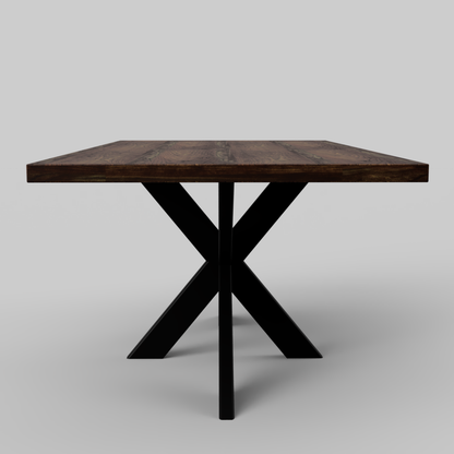 hardwood dining table with a spider base and a grey background